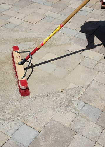 Sweeping the paver joints